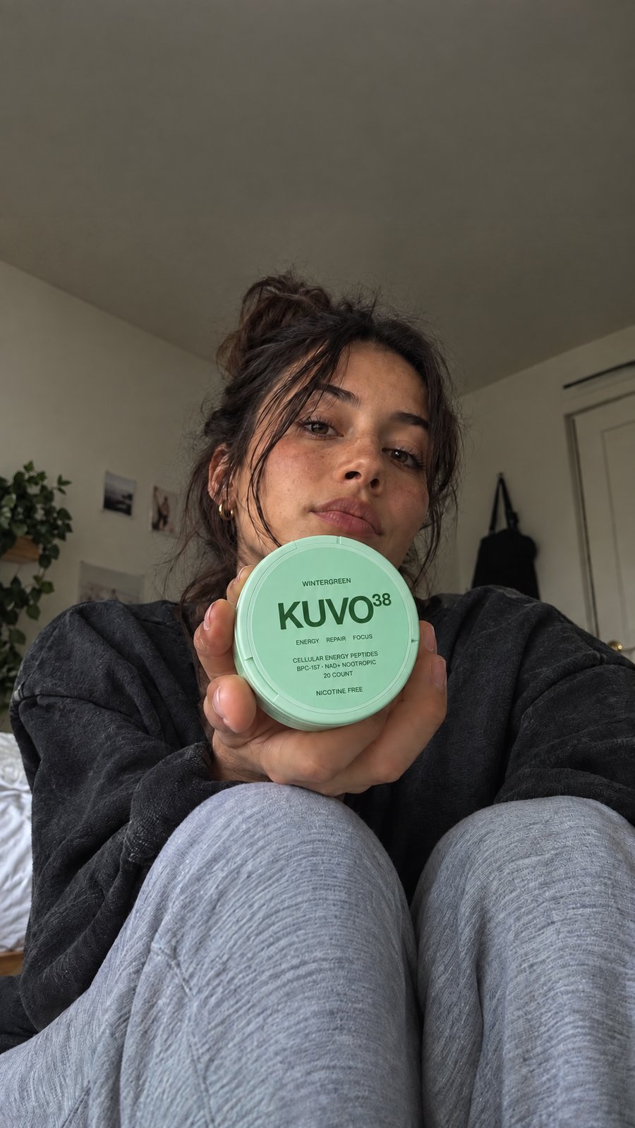 Holding a Kuvo38 pouch at home